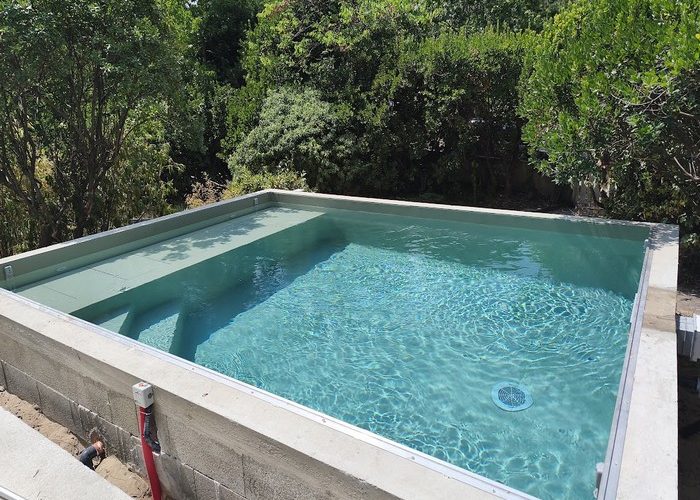 Piscine traditionnelle maçonnée menbrane armée avec volet immergé sous plage Piraillan Cap Ferret 6