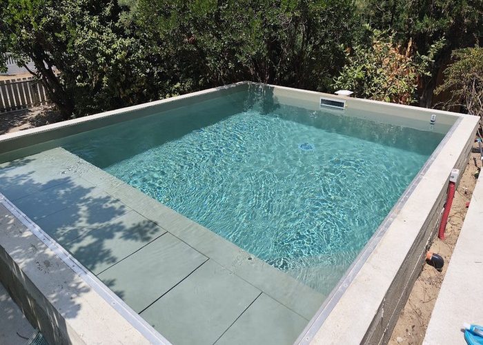 Piscine traditionnelle maçonnée menbrane armée avec volet immergé sous plage Piraillan Cap Ferret 7 bis